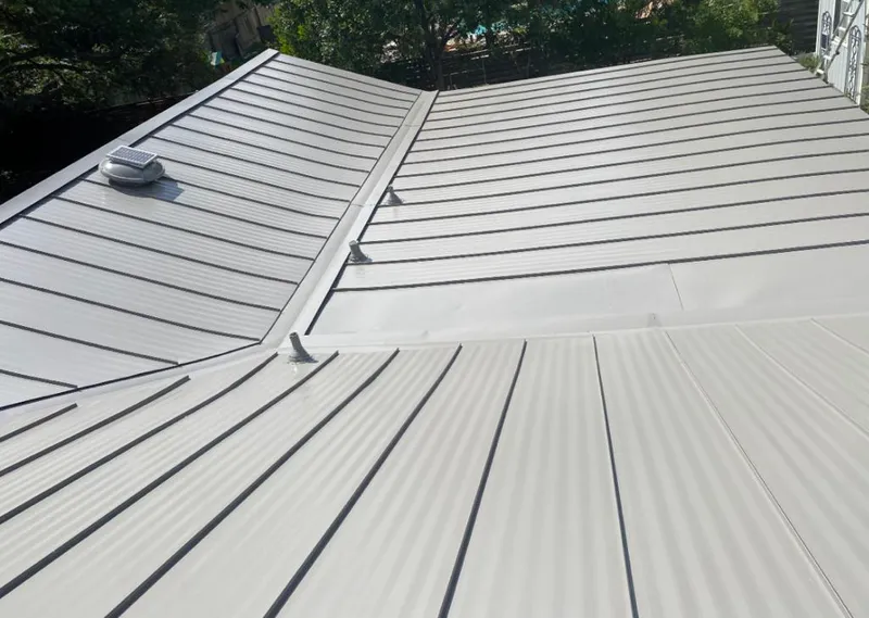 Solar attic fan installed on a metal roof for Roof Ventilation in Bluffton